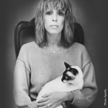photo of Cynthia Weil seated while holding a cat