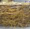 A semi sphere that is six feet in diameter and made from woven willow branches